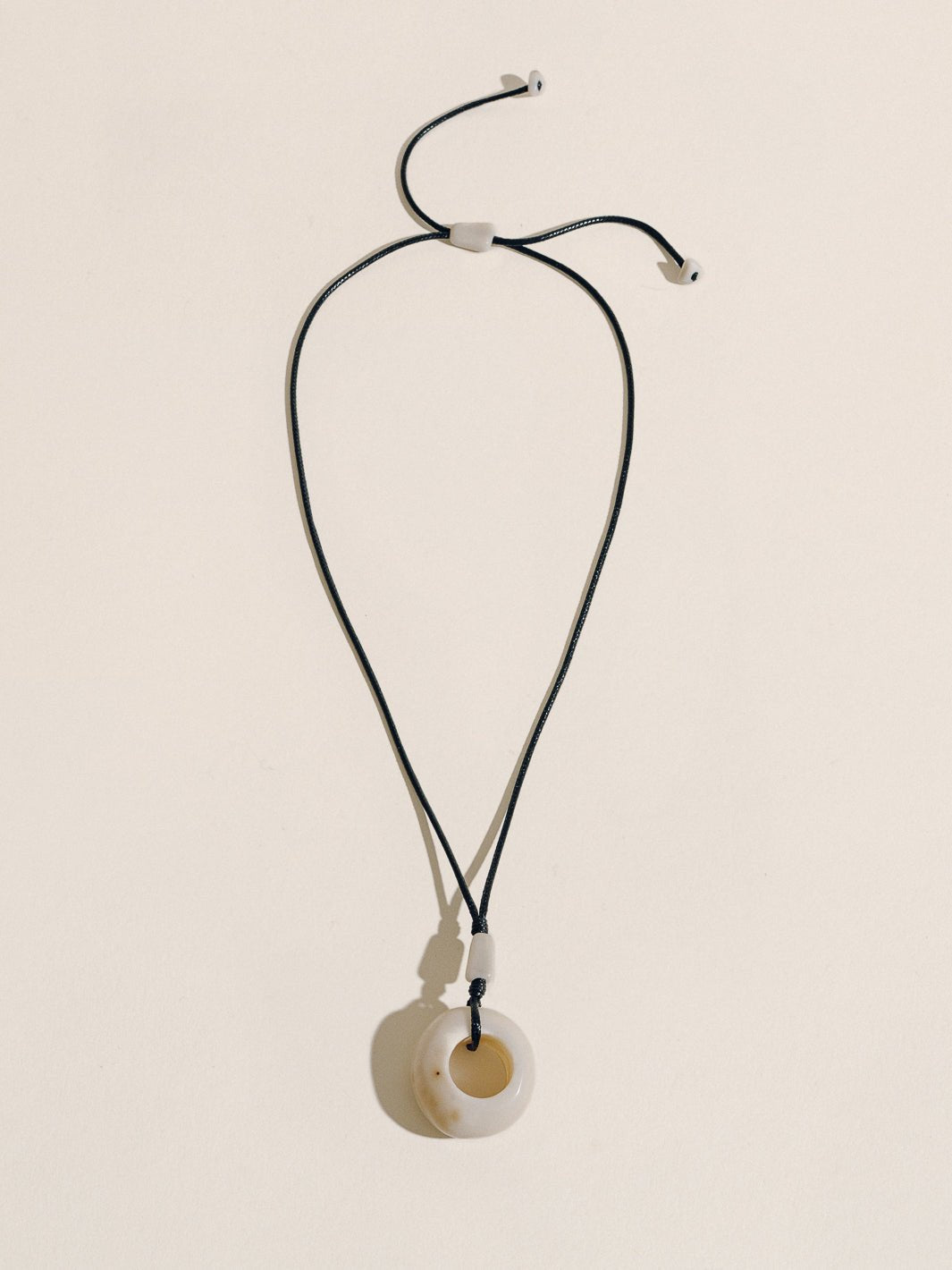 TAGUA CIRCLE PENDANT
